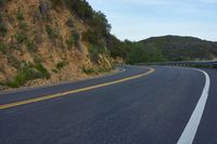 California Dawn: Scenic Road with Curves and Mountain Landscape