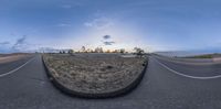 a view of a empty road through fisheye lens glasses of the landscape with mountains