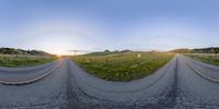 two wide shot views of a road through the grass at sunset with a sky background