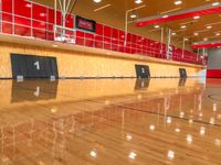 a basketball court with wooden floors and wood walls in the center of it is red