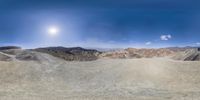 this is an image of the desert area looking up at the sky in a fisheye panoramic photograph