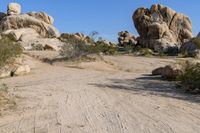 California Desert Road: Tracks under a Clear Sky
