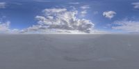 a view of a sky with white clouds from different angles, with a snowboard on the bottom right hand side