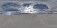 a fisheye lens shot of a cloud over a factory in the sky, which looks like an octopus shaped structure