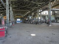 some machinery inside of a building with windows and a sign in front of them that says steel city