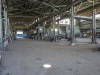 some machinery inside of a building with windows and a sign in front of them that says steel city