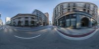 an image of a street in the mirror view of an object and buildings surrounding it