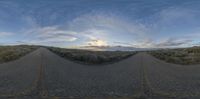 a view from a fish eye lens, with multiple sides of road curves and a sky background