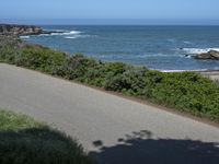 California Highway: Asphalt, Grass, and Coastal Views