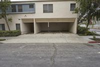 the driveway is empty of cars but it seems to be a nice place for parking