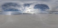 a fisheye lens shot of a cloud over a factory in the sky, which looks like an octopus shaped structure