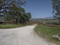 this is an image of the entrance to a ranch gate on the side of the road