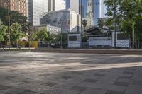 a public plaza is in the city square, in between skyscrapers and other buildings