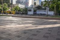 a public plaza is in the city square, in between skyscrapers and other buildings