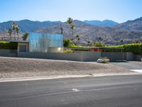 this is an image of a modern home in the desert with mountains in the background