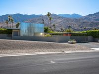 this is an image of a modern home in the desert with mountains in the background