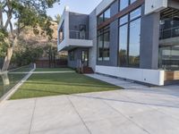 concrete slab on the sidewalk outside a modern home designed to be in residence on the california foothills