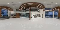 a view from the fish eye of a curved staircase and spiral design on the floor