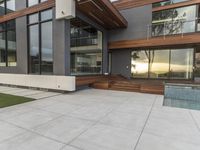 a concrete patio and modern home exterior of a modern house with nice colors and texture