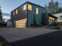 the blue house has two garages on each story and is lighted at night by led lighting