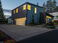 the blue house has two garages on each story and is lighted at night by led lighting