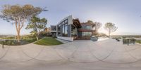 a view of a skate park and house in a 360 - view lens lens at this time