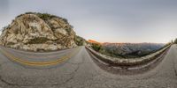 a fisheye lens shows how the road looks on top of a mountain, while on a cloudy day