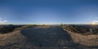 an image of a view from a car window in the desert at sunset time on a road