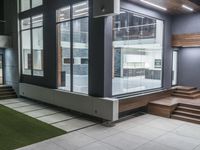 a modern home with white tile floors and black trims that sits in the center of large area