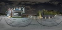 an upside down view of a skate park at night time with the lights on in front of the building