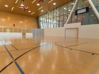 an indoor basketball court is shown here, and the lighting in this room makes it look like something inside of a house