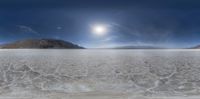 a photo taken in time lapse over an empty area on a cloudy day with a blue sky and small clouds