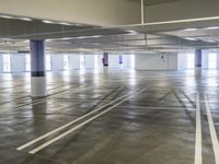 empty parking garage filled with lots of spaces to move around on the hard surface inside