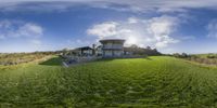 a 3d image of a modern home overlooking the green field, which has stairs and a roof