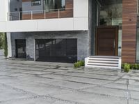 the exterior and landscape of a modern house in los angeles, california with stone and wood