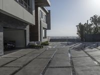 the exterior and landscape of a modern house in los angeles, california with stone and wood