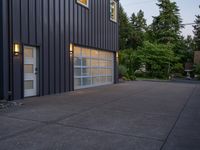 a garage door sitting next to a building with two windows and a bike rack in the front