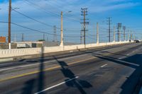 California Road: Bridge Overhead on Asphalt, with Clouds in the Sky