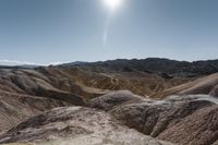 a very scenic photo of a large, badlands like area with huge rocks on it