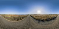 there is a wide angle 360 - view photo of an empty road in a desert