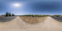 this photo depicts the view of a bike track from another perspective in front of the sky