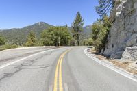 a bend on a mountain road is seen in this image taken from the ground below