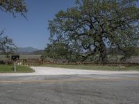 this is an image of the entrance to a ranch gate on the side of the road