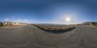 a fish eye lens view of a rural road in a california neighborhood by the ocean