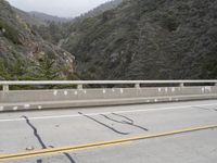 a road with markings painted on it and a yellow line on the side of the road