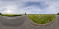 this is an image of a road with no traffic on it in the sky in the grass