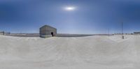 a 360 - degree photograph of a skateboarder at the skate park near the parking lots