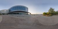 this is an image of a panoramic view of a skateboard park with a building in the background