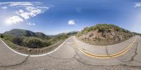 a three way view of a road and hill top in the california stateline as seen on a fish - eye lens