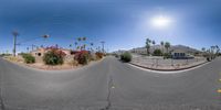 the view of a road from a fisheye lens, as seen by someone in an orange jacket